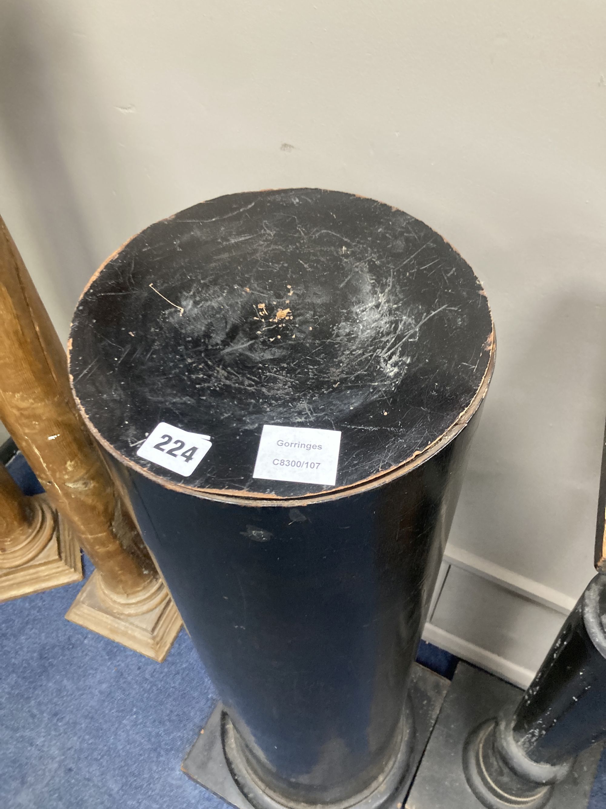 An ebonised wood column, height 99cm